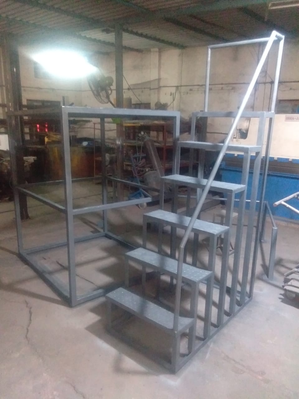 Ladder with Platform Manufacturers in India by Megamech Industries Pvt Ltd